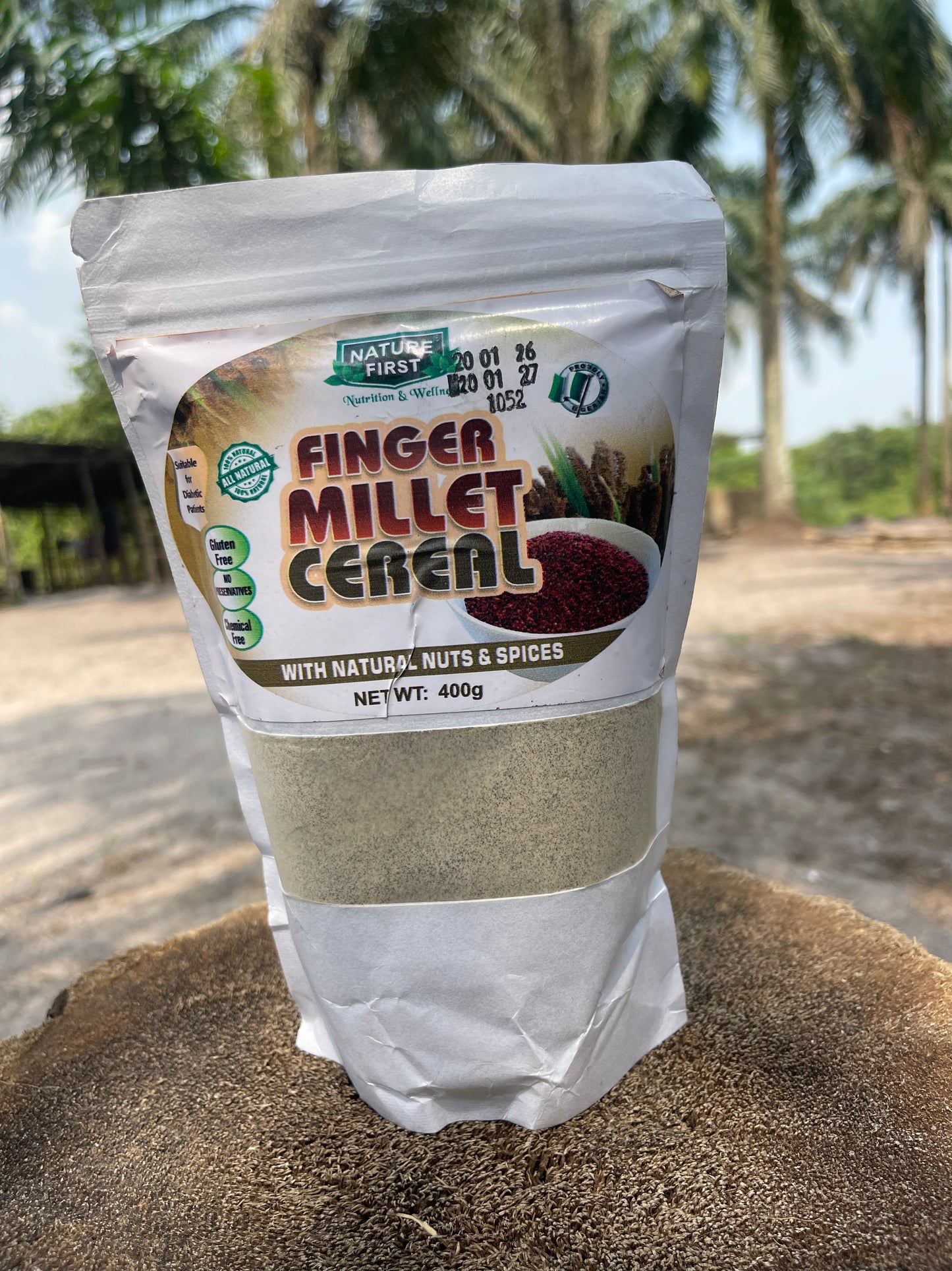 Package of Finger Millet Cereal with palm trees in the background